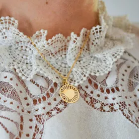 Médaille or coeur rayonnant